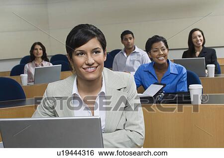 Business people sitting in classroom View Large Photo Image Stock Photograph - Business people sitting in classroom. Fotosearch