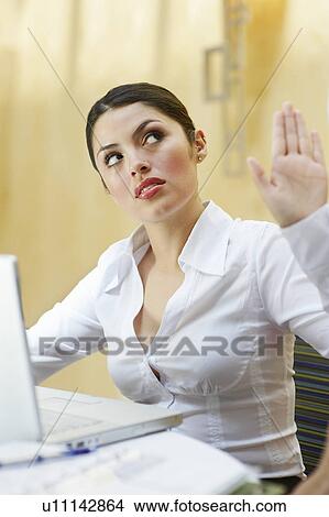 Business woman using laptop in office View Large Photo Image Picture - Business woman using laptop in office. Fotosearch