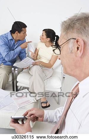 Businessman Assisting Angry Couple View Large Photo Image Stock Photography - Businessman Assisting Angry Couple. Fotosearch