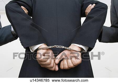 Stock Photography - Businessman Being Arrested. Fotosearch