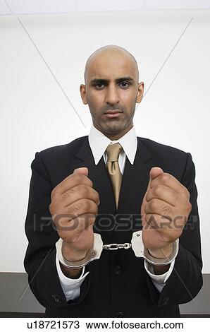 Businessman in Handcuffs View Large Photo Image Stock Image - Businessman in Handcuffs. Fotosearch