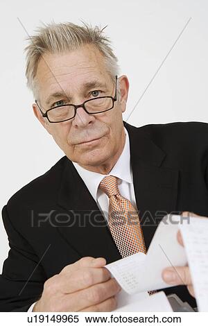 Businessman Looking at Calculator Paper View Large Photo Image Stock Photography - Businessman Looking at Calculator Paper. Fotosearch