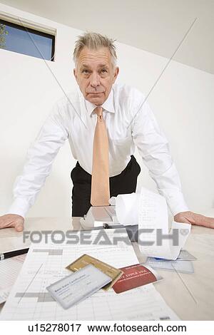 Businessman Looking at Credit Cards View Large Photo Image Stock Photo - Businessman Looking at Credit Cards. Fotosearch