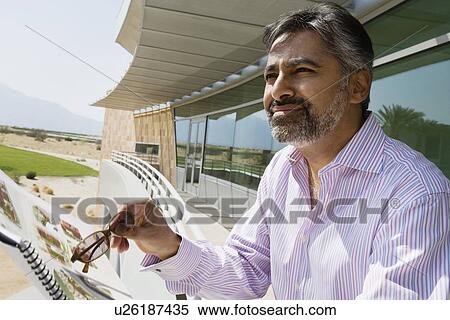 Stock Photography - Businessman Standing on Balcony. Fotosearch