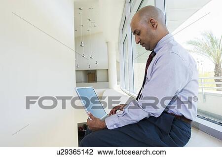 Businessman Using a Laptop View Large Photo Image Stock Image - Businessman Using a Laptop. Fotosearch