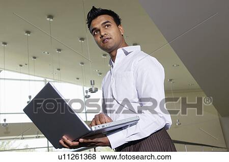 Businessman Using a Laptop View Large Photo Image Stock Photo - Businessman Using a Laptop. Fotosearch
