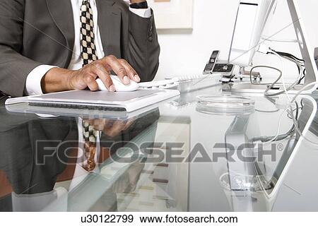 Stock Photo - Businessman Using a Mouse. Fotosearch