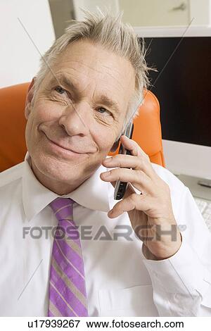 Businessman Using Cell Phone View Large Photo Image Stock Photo - Businessman Using Cell Phone. Fotosearch