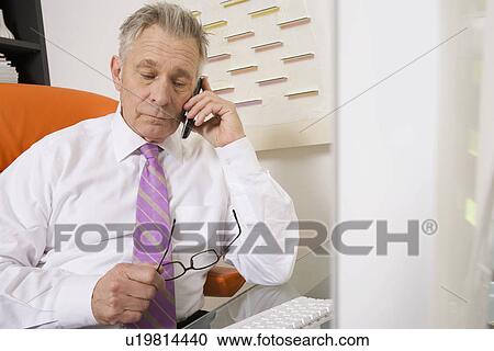 Businessman Working at Desk View Large Photo Image Stock Image - Businessman Working at Desk. Fotosearch