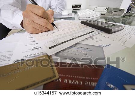 Stock Photo - Businessman Working at Desk. Fotosearch