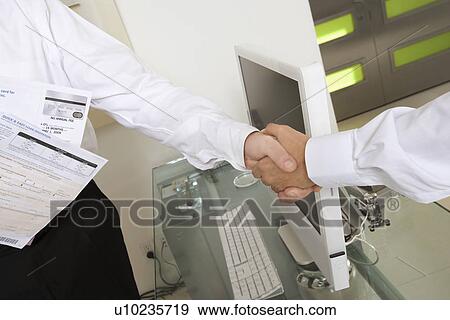 Stock Photo - Businessmen Shaking Hands. Fotosearch