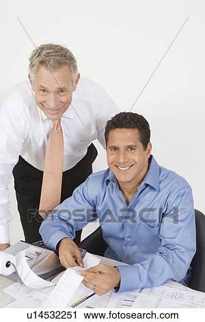 Stock Image - Businessmen Working in Office. Fotosearch
