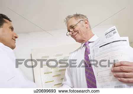 Businessmen Working in Office View Large Photo Image Stock Image - Businessmen Working in Office. Fotosearch