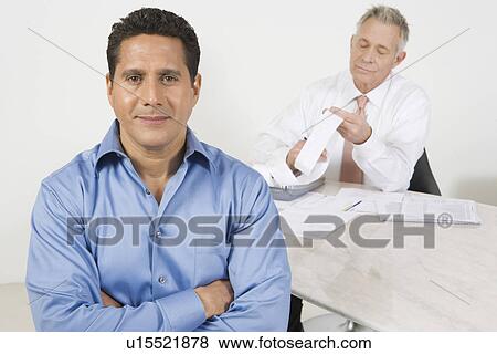 Stock Photo - Businessmen Working in Office. Fotosearch