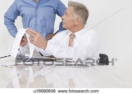 Stock Photo - Businessmen Working in Office. Fotosearch