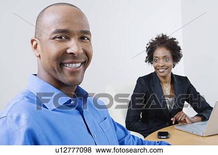 Stock Photo - Businesspeople in Meeting. Fotosearch