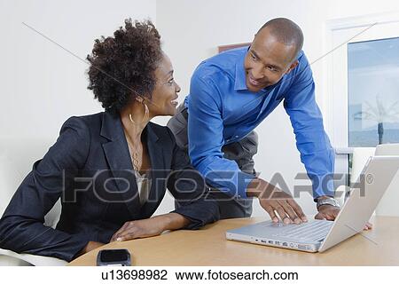 Businesspeople Using Laptop During Meeting View Large Photo Image Stock Image - Businesspeople Using Laptop During Meeting. Fotosearch