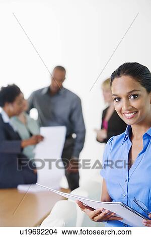 Picture - Businesswoman in Meeting. Fotosearch