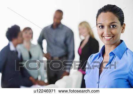 Stock Image - Businesswoman in Meeting. Fotosearch