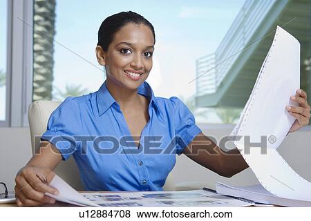 Businesswoman Looking at Papers View Large Photo Image Stock Photo - Businesswoman Looking at Papers. Fotosearch