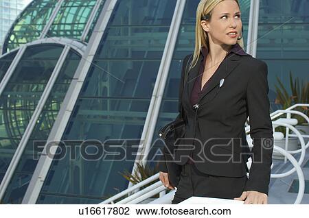 Businesswoman outside office building View Large Photo Image Stock Image - Businesswoman outside office building. Fotosearch