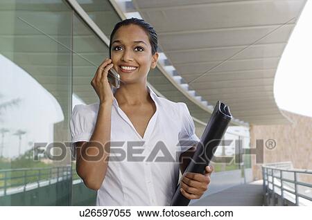 Stock Photography - Businesswoman Talking on a Cell Phone. Fotosearch