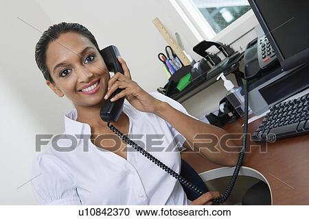 Businesswoman Using Telephone View Large Photo Image Stock Image - Businesswoman Using Telephone. Fotosearch