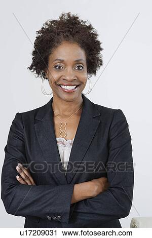 Businesswoman with Arms Crossed View Large Photo Image Stock Image - Businesswoman with Arms Crossed. Fotosearch