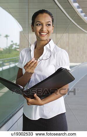 Stock Image - Businesswoman with Daily Organizer. Fotosearch