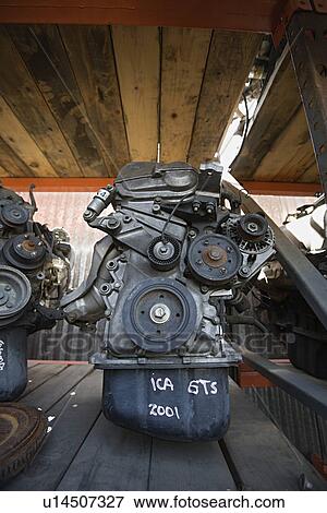Stock Photo - Car engines in junkyard. Fotosearch