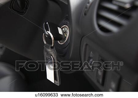 Stock Image - Car ignition with key, close-up. Fotosearch