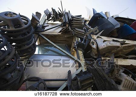 Stock Photo - Car parts in Junkyard. Fotosearch