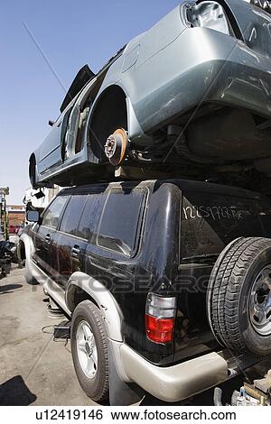 Stock Photograph - Cars in junkyard. Fotosearch