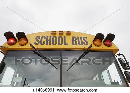 Stock Image - Caution Lights Flashing on School Bus. Fotosearch
