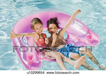 Children Playing on Inflatable Toy in Swimming Pool View Large Photo Image Picture - Children Playing on Inflatable Toy in Swimming Pool. Fotosearch