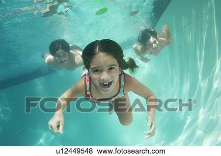 Children swimming, underwater view View Large Photo Image Stock Photo - Children swimming, underwater view. Fotosearch