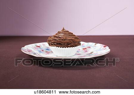 Chocolate cupcake on plate View Large Photo Image Stock Image - Chocolate cupcake on plate. Fotosearch