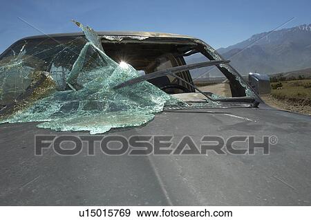 Stock Photo - Close-up of car with broken windshield. Fotosearch