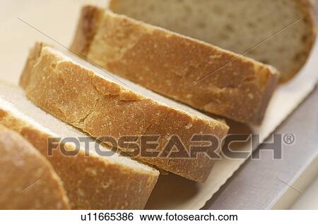 Close-up of sliced baguette View Large Photo Image Stock Photograph - Close-up of sliced baguette. Fotosearch