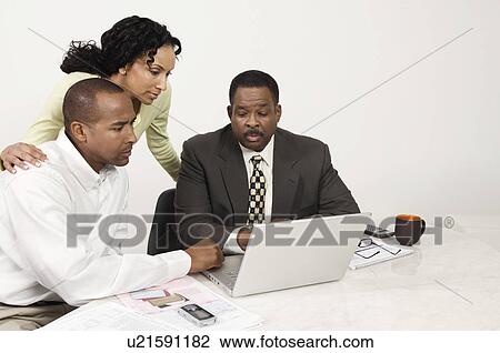 Couple and Accountant Using Laptop View Large Photo Image Stock Image - Couple and Accountant Using Laptop. Fotosearch