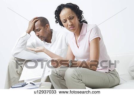 Stock Image - Couple Arguing About Bills. Fotosearch
