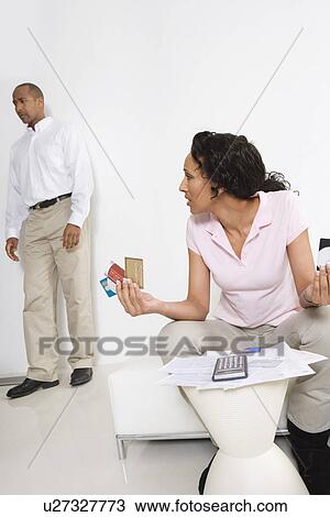 Couple Arguing About Credit Card Bills View Large Photo Image Stock Image - Couple Arguing About Credit Card Bills. Fotosearch