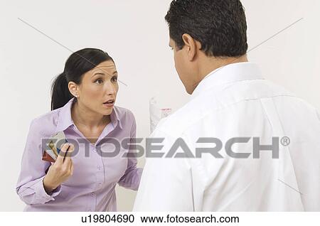 Stock Image - Couple Arguing About Finances. Fotosearch