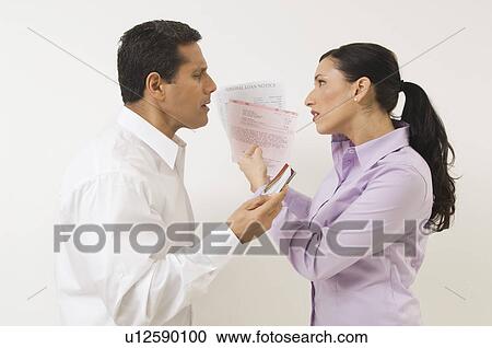 Stock Image - Couple Arguing About Money. Fotosearch