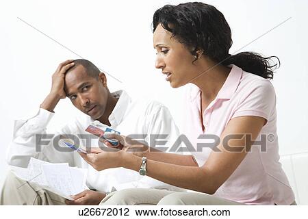 Couple Discussing Bills View Large Photo Image Stock Image - Couple Discussing Bills. Fotosearch