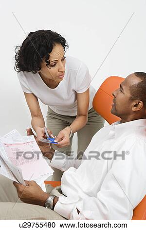 Couple Discussing Bills View Large Photo Image Stock Image - Couple Discussing Bills. Fotosearch