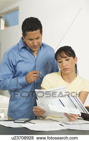 Stock Photo - Couple Discussing Bills. Fotosearch