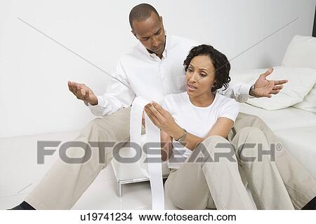 Picture - Couple Discussing Finances. Fotosearch