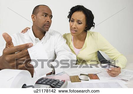 Stock Image - Couple Doing Finances. Fotosearch