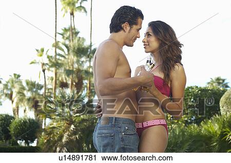 Couple embracing outdoors, side view View Large Photo Image Stock Image - Couple embracing outdoors, side view. Fotosearch